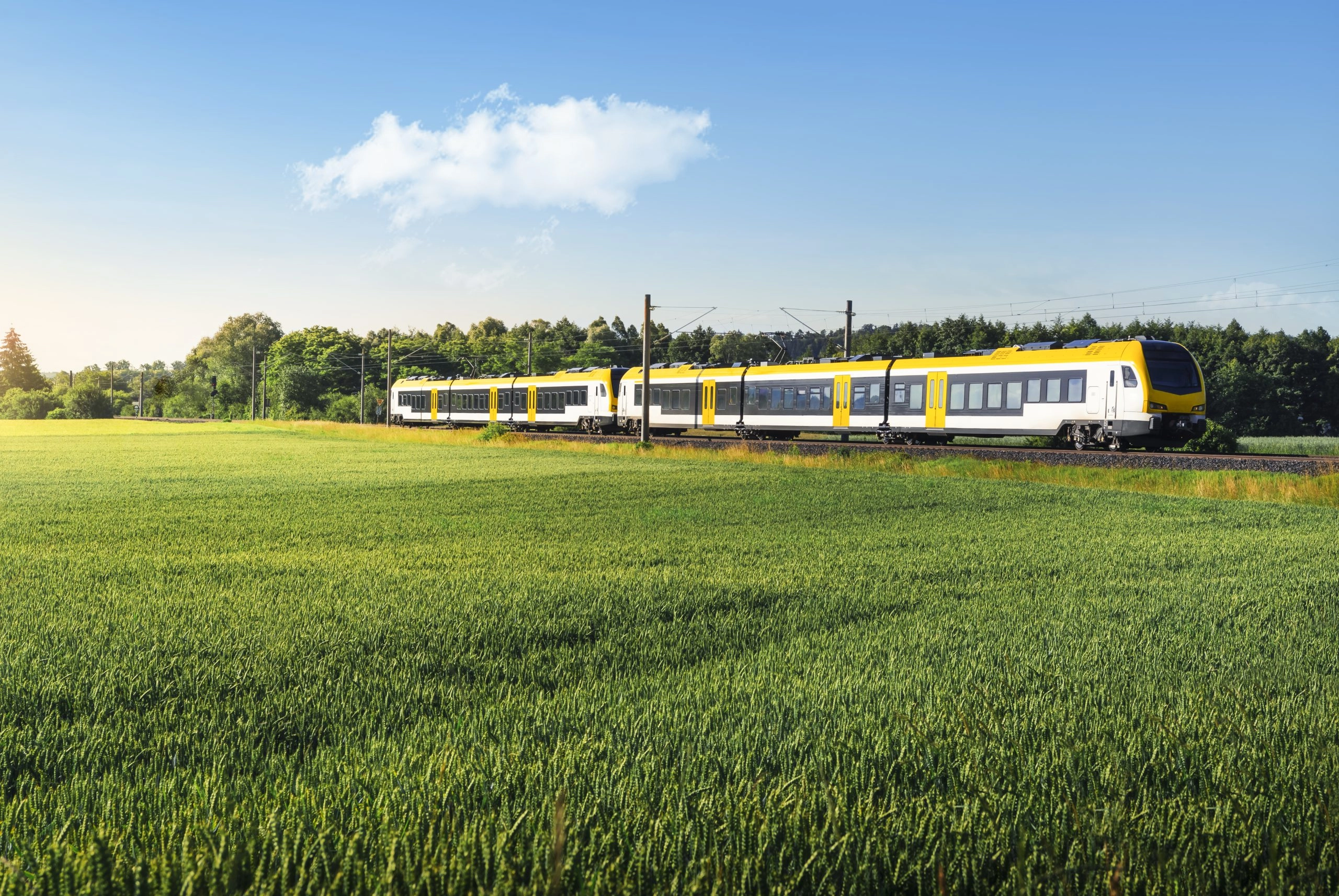 German passenger train in motion. Yellow electric train travelin